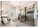 Elegant bathroom with a soaking tub, glass shower, and double vanity at 3518 N Shadow Trl, Mesa, AZ 85207