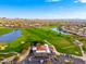Aerial view of the golf course, lake, community building and surrounding neighborhoods at 3518 N Shadow Trl, Mesa, AZ 85207