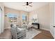 Bright home office with two large windows, a modern desk, and comfortable seating at 3518 N Shadow Trl, Mesa, AZ 85207