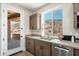 Kitchen area showcasing wooden cabinets, stainless steel appliances, countertops, and a window with a desert view at 3518 N Shadow Trl, Mesa, AZ 85207