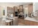 Gourmet kitchen boasts custom cabinetry, stainless steel appliances, and an island with seating at 3518 N Shadow Trl, Mesa, AZ 85207