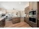 Open-concept kitchen features modern appliances, custom cabinetry, and a central island at 3518 N Shadow Trl, Mesa, AZ 85207