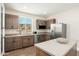 This kitchen features wood cabinetry, stainless steel appliances and sink with a lovely view of the outdoors at 3518 N Shadow Trl, Mesa, AZ 85207