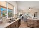 Kitchen sink in front of a large window with mountain views with modern fixtures and wood cabinets at 3518 N Shadow Trl, Mesa, AZ 85207