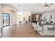 Bright living room showcasing hardwood floors, contemporary furnishings, and an open design concept at 3518 N Shadow Trl, Mesa, AZ 85207