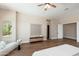 Large main bedroom featuring wood floors, bright windows, and a ceiling fan at 3518 N Shadow Trl, Mesa, AZ 85207