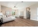 Bright main bedroom with a seating area, wood floors, and neutral decor at 3518 N Shadow Trl, Mesa, AZ 85207
