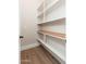 Walk-in pantry with custom white shelves at 3518 N Shadow Trl, Mesa, AZ 85207