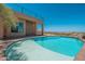 Backyard oasis with blue swimming pool, patio, and desert landscape view at 3518 N Shadow Trl, Mesa, AZ 85207