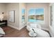 Sitting area with a pool view, natural light, and stylish chaise lounge at 3518 N Shadow Trl, Mesa, AZ 85207