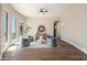Cozy sitting area with large windows, comfortable furniture, a decorative mirror and hardwood floors at 3518 N Shadow Trl, Mesa, AZ 85207