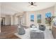 Inviting sitting area offering stylish seating, hardwood floors, and beautiful outdoor scenery at 3518 N Shadow Trl, Mesa, AZ 85207