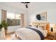 Bedroom featuring a modern aesthetic, wood floors, and natural light from the window at 902 E Goldenrod St, Phoenix, AZ 85048