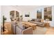 Bright living room features modern furnishings, hardwood floors, and large windows at 902 E Goldenrod St, Phoenix, AZ 85048