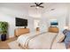 Spacious main bedroom featuring neutral tones, an ensuite bath and vaulted ceilings at 902 E Goldenrod St, Phoenix, AZ 85048