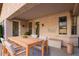 Outdoor patio with dining table and chairs, perfect for entertaining or relaxing at 902 E Goldenrod St, Phoenix, AZ 85048