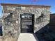 Gated community entrance with stone pillars and black metal gate at 1184 E Gleneagle Dr, Chandler, AZ 85249