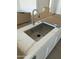 Modern kitchen sink and faucet with quartz countertop at 1184 E Gleneagle Dr, Chandler, AZ 85249