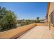Relax on this balcony with a black metal railing and enjoy views of neighboring houses and trees on a sunny day at 15115 W Cottonwood St, Surprise, AZ 85374