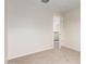 Clean and bright bedroom with neutral paint, carpet and a view of the landing at 15115 W Cottonwood St, Surprise, AZ 85374