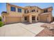 Beautiful two-story home with a three-car garage and desert landscaping at 15115 W Cottonwood St, Surprise, AZ 85374
