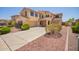 Beautiful two-story home with a three-car garage and desert landscaping at 15115 W Cottonwood St, Surprise, AZ 85374