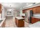 Open kitchen featuring stainless steel appliances, granite countertops, and a central island at 15115 W Cottonwood St, Surprise, AZ 85374