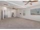 Large main bedroom with neutral carpet, recessed lighting, and ample natural light at 15115 W Cottonwood St, Surprise, AZ 85374