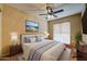 Serene bedroom featuring a ceiling fan and ample natural light at 3128 E Millbrae Ln, Gilbert, AZ 85234