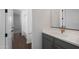 A bathroom featuring a sleek vanity and doorway to other rooms at 4106 W Eli Dr, San Tan Valley, AZ 85144