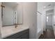 A bathroom featuring a vanity, a large mirror, and an adjacent room at 4106 W Eli Dr, San Tan Valley, AZ 85144