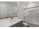 A modern bathroom with sleek vanity, a large mirror, and tub-shower combination at 4106 W Eli Dr, San Tan Valley, AZ 85144