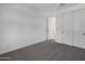 Spacious carpeted bedroom with closet and a view into the house at 4106 W Eli Dr, San Tan Valley, AZ 85144