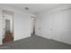 A well-lit bedroom featuring neutral carpet, and access to other rooms at 4106 W Eli Dr, San Tan Valley, AZ 85144