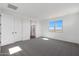 New carpeted bedroom with large windows and two closets at 4106 W Eli Dr, San Tan Valley, AZ 85144