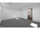 New carpeted bedroom with access to the bathroom at 4106 W Eli Dr, San Tan Valley, AZ 85144