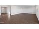 Bright, open living space with wood-look flooring; versatile and welcoming at 4106 W Eli Dr, San Tan Valley, AZ 85144
