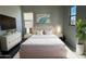 Cozy bedroom with a comfortable bed, bedside tables, and ample sunlight at 10015 W Verde Ln, Avondale, AZ 85392