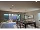 Elegant dining room with stylish lighting and access to outdoor seating area at 10015 W Verde Ln, Avondale, AZ 85392