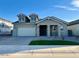 Charming single-story home features a manicured lawn and a two-car garage at 10015 W Verde Ln, Avondale, AZ 85392