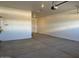 Spacious garage features a clean concrete floor and ample lighting at 10015 W Verde Ln, Avondale, AZ 85392