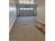 Garage with a concrete floor and closed garage door at 10015 W Verde Ln, Avondale, AZ 85392