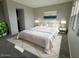 Calming main bedroom with a plush rug and abundant natural light at 10015 W Verde Ln, Avondale, AZ 85392