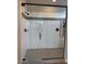 Luxurious walk-in shower featuring glass enclosure and modern fixtures at 10015 W Verde Ln, Avondale, AZ 85392