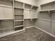 Spacious walk-in closet with shelving and hanging rods at 10015 W Verde Ln, Avondale, AZ 85392