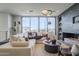 Elegant living room with a sectional sofa and a sleek fireplace at 4946 N Ascent Dr, Scottsdale, AZ 85251