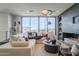 Spacious living room with modern fireplace and large windows at 4946 N Ascent Dr, Scottsdale, AZ 85251