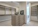 Large walk-in closet with ample shelving and drawers at 4946 N Ascent Dr, Scottsdale, AZ 85251