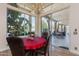 Bright dining room with a chandelier, large windows, and access to the patio at 10512 E Cortez Dr, Scottsdale, AZ 85259