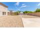 Gravel and grass backyard with pool and home view at 11543 E Quade Ave, Mesa, AZ 85212